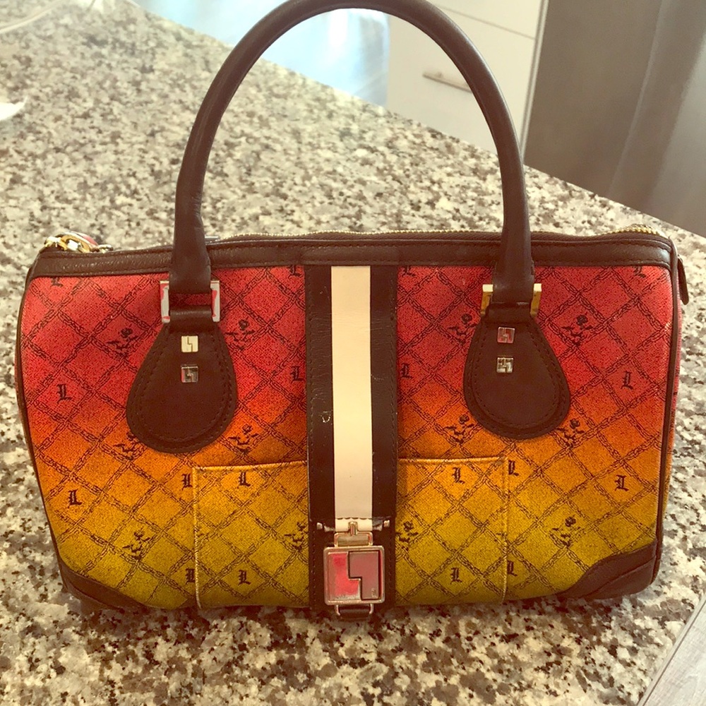 A Rare Gwen Stefani (L.A.M.B) Rasta colored purse.